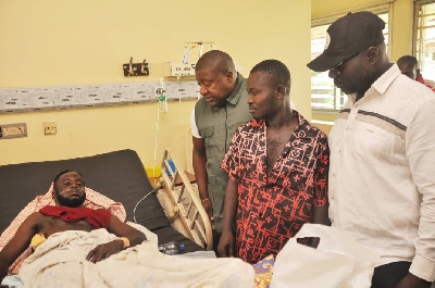 Nana B and his team visiting the victim of the violence at the hospital