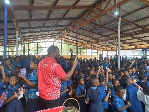Schoolchildren celebrating 2024 World Oral Health Day with Duala Medical Centre and Colgate