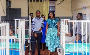 NHIA Deputy Chief Executive for Operations, Louisa Atta-Agyemang and hospital officials  inspecting facilities