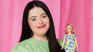 British model Ellie Goldstein with Barbie's first doll representing someone with Down's syndrome