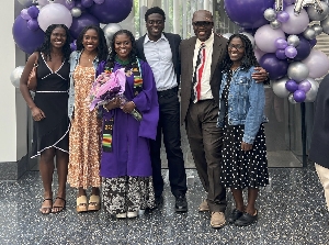 Albert Okine, in suit and tie, and family at his daughter's 2026 graduation
