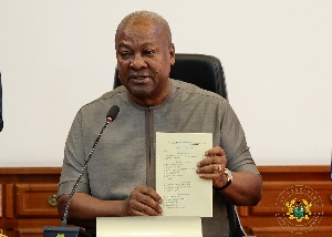 President Mahama assenting the bill