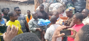 Dagombaline fire victims receiving donations from the KMA mayor