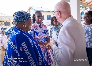 Alma Pokua Adade-Prempeh interacting with Rev Father Campbell