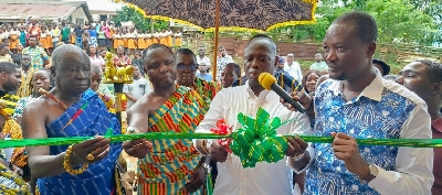 Lands Minister cutting the tape to unveil the project