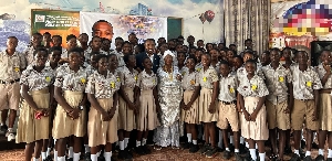 Jerry Ahmed Shaib in a group photograph with beneficiary students