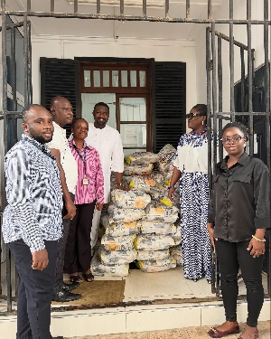 John Dumelo presenting the food items Legon officials