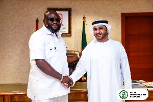 Mr Michael Kpakpo Allotey aH.E. Dr. Abdulla Al Mandoos in a hand shakend