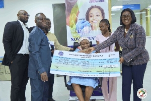 Oboubia Darko-Opoku presenting the checque  for Rebecca's treatment