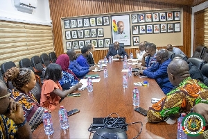 Local Gov't Minister in a meeting with UK envoy in his office in Accra