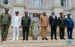 Preident and his Vice  in a group photograpgh with the out-going Service Chiefs