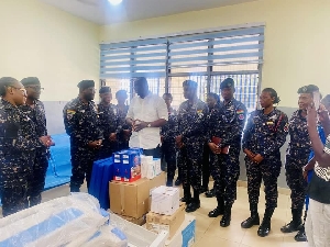 Mr Boamah presenting the equipment to management of the clinic