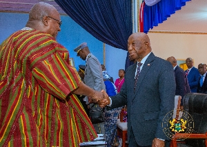 President Mahama and President Joseph Nyuma Boakai  shaking hands at the event
