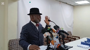 Charles J. Owusu, addressing the press