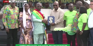 Opanyin Abraham Kwaku Adusei receiving his award from President Mahama