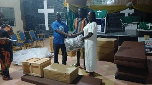 Some students receiving the items presented by Dr  Toni Aubynn
