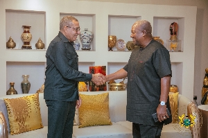 His Excellency Carlos Vila Nova in hand shake with President Mahama
