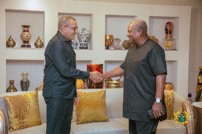 His Excellency Carlos Vila Nova in hand shake with President Mahama