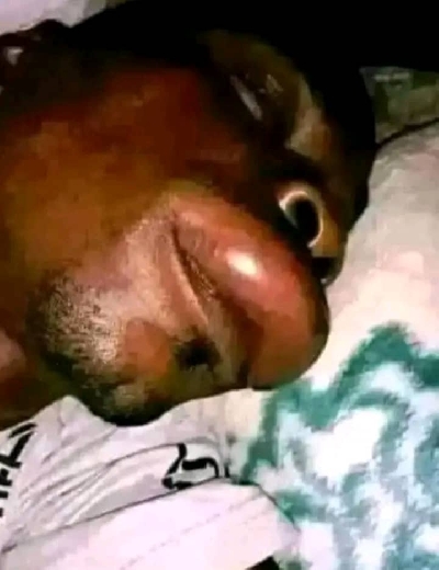 A victim lying on his sick bed