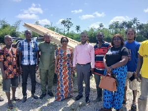 MP and community members in a group photo after inspecting the projecth