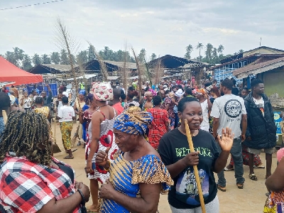 Clean-up exercise with women holding brooms