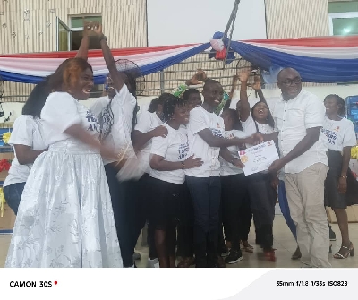 The MP presenting the award to beneficiaries