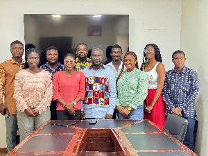 Okai Mintah in a pose with UNIMAC TEIN  members