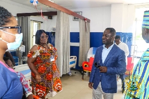 Minister engaging with health workers during of Greater Accra Region