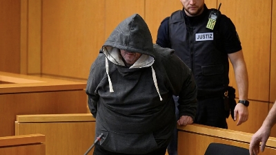 Getty Images (Pic): Fernando P being escorted into the regional court in Aachen, western Germany