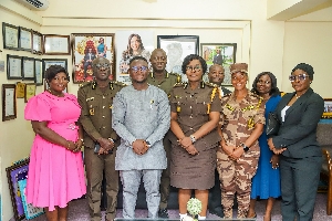 MCE is a group photograph with Prisons Service officials
