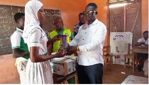 MCE  presenting the maths set to the candidates