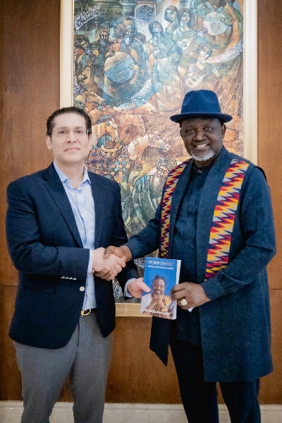 Archbishop Dr. Charles Agyinasare presenting one of his books to the Vice Consul Hon. Omar Shahid Butt of the Honorary Consulate of the Republic of Ghana in Islamabad