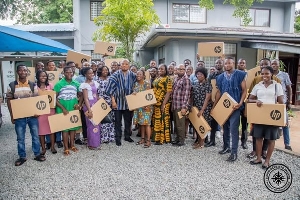 Benficiary teachers displaying their laptops