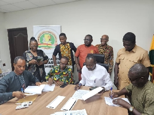 Officials of FWSC and SSA-UoG signing an agreement