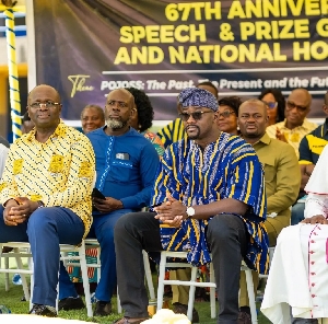 Defence Minister seated with other dignitaries on the dais