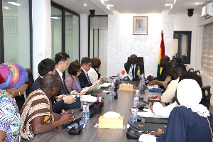 Officials of JICA  and Finince Minister  signing the agreement