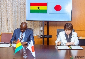 Haruna Iddrissu signing the MoU with the Japanese goverment