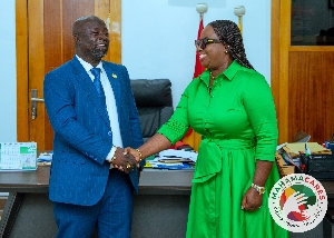 Madam Obuobia Darko Opoku in a hand shake with  Kumasi Mayor