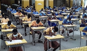 Some students writing BECE papers