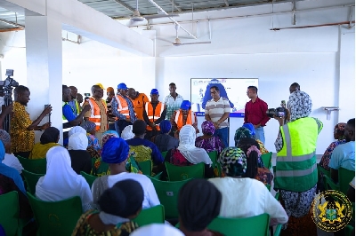 Minster interacting with the women