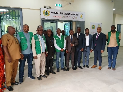 Health Minister in a photo with team members after the handing over ceremonynin Accra