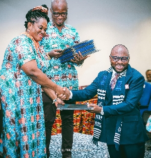 Osman Ayariga receiving his certificate induction last Friday