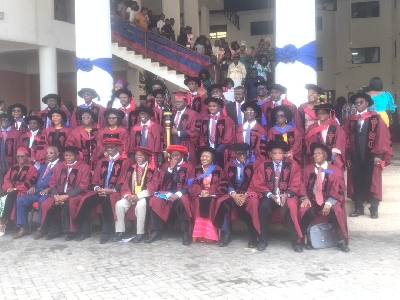 Prof Kwawukume seated in a group photo  with the graduates after the event