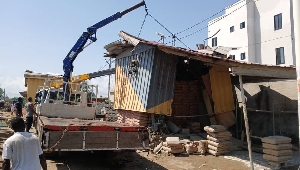 Th container being lifted by the taskforce