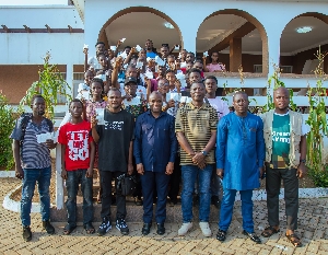 Felix Kwakye Ofosu in a group photograph with beneficiaries