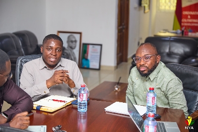Edem Agbana interacting with Usman Ayariga at the meeting