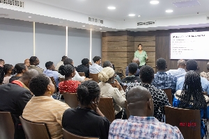 Dr. Daniella C. E. Chinery-Hesse addressing staff