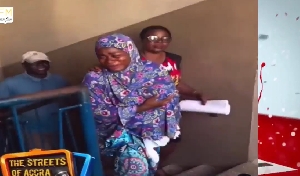 Arrested woman at Abossey Okai Zongo