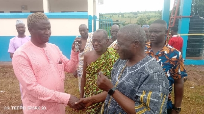 Municipal Education Director handing over facility keys to Imam Seidu Islamic School headmaster, Hussein Zakariya